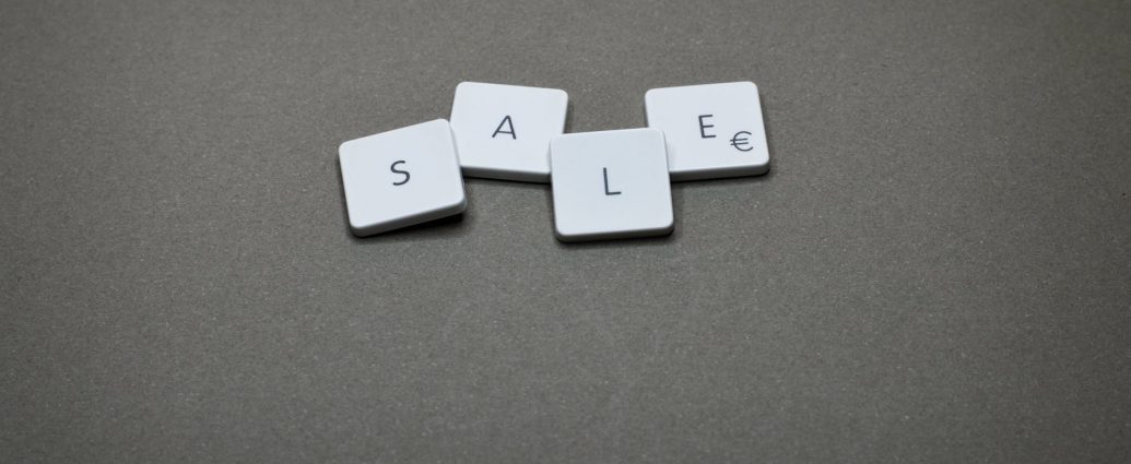 four white sale boards