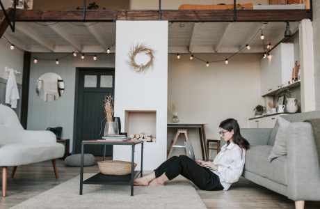 woman sitting on the floor using a laptop