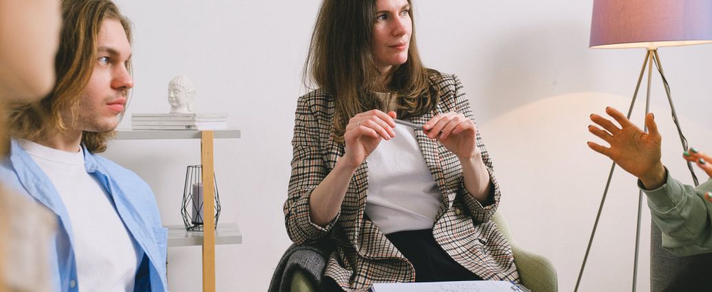 people discussing project in light room