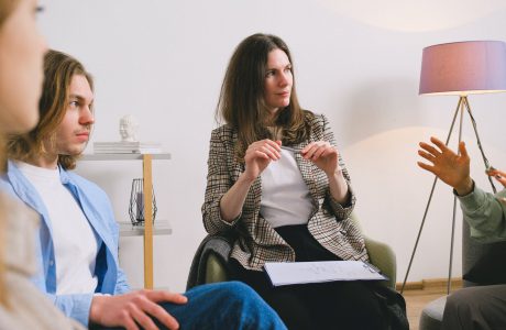 people discussing project in light room