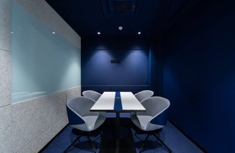 contemporary workspace with blue seats and table