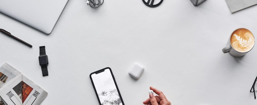 top view photo of person holding earphones