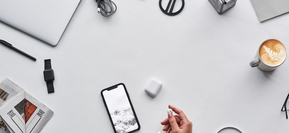 top view photo of person holding earphones