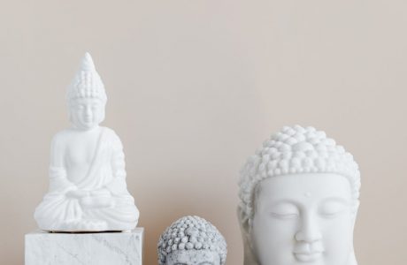 composition of buddha statues on marble stand