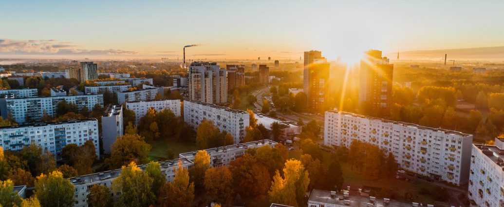 aerial view of white concrete buildings during golden hours