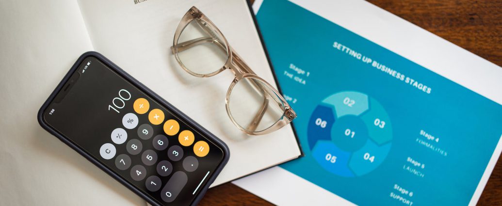 calculator and eyeglasses on document papers