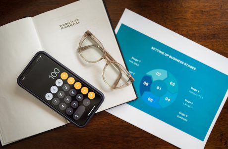 calculator and eyeglasses on document papers