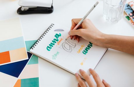 a person drawing on a sketchpad