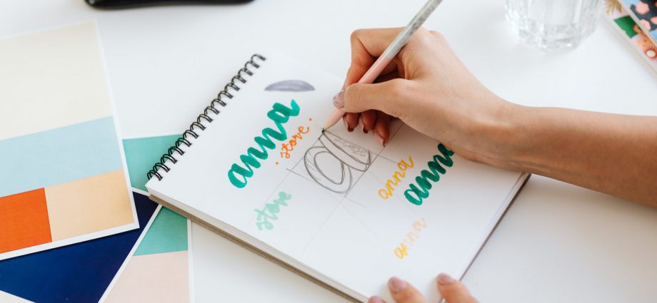 a person drawing on a sketchpad